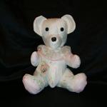 This bear was made from a little girl's dress.  She is now in here 20's and it was given to her as a surprise.  