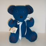 This bear was made from a women's sweater and blue jeans